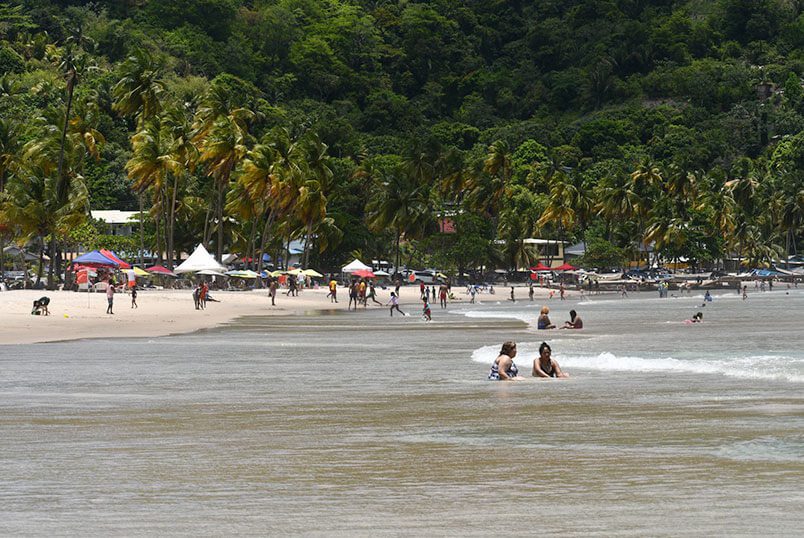 Bathers enjoying the low tide at Maracas Beach